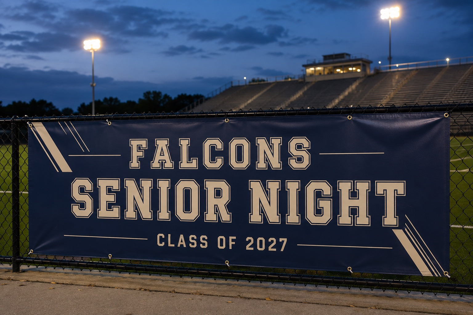 Illustrated navy Falcons senior-night banner at a floodlit sports field